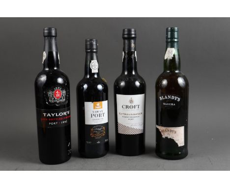 A bottle of Taylor's vintage port, a bottle of Croft reserve port, a bottle of Tawny port and a bottle of Blandy's Madeira