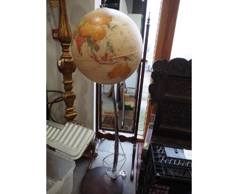 A 15" illuminating terrestrial globe with routes of the great explorers, on chrome stand and circular base, 47" highCondition