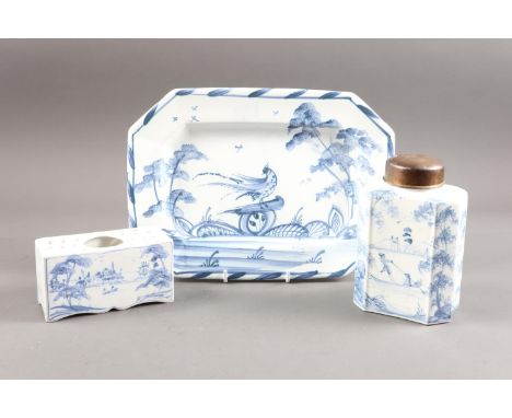 An Oxford delft flower brick, a tea caddy and cover, and an octagonal plate, caddy 6 1/2" high