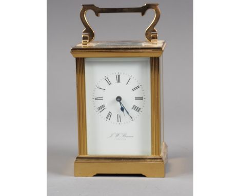A brass cased carriage clock by J W Benson with white enamel dial and Roman numerals, 5 3/4" high overallCondition:The balanc