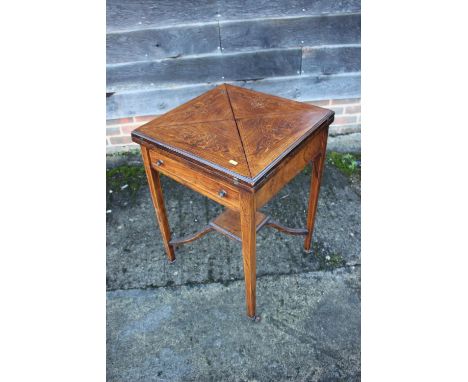 A late 19th century rosewood and inlaid envelope top card table, on square taper supports, 19 1/2" sq x 28 1/2" high
