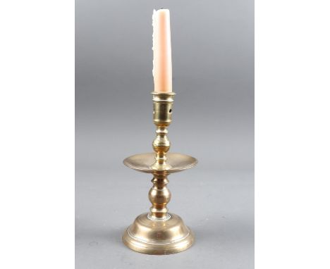 A 17th century brass candlestick with broad drip pan, 7 3/4" high (ex Witney Antiques)