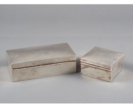 A rectangular silver cigarette box with engraved signature and a smaller square silver cigarette box with engine turned lid