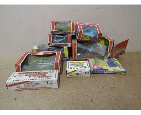 A quantity of boxed Britain's diecast farm vehicles and implements to include Ford 5000 tractor No. 9527, Forage Harvester No