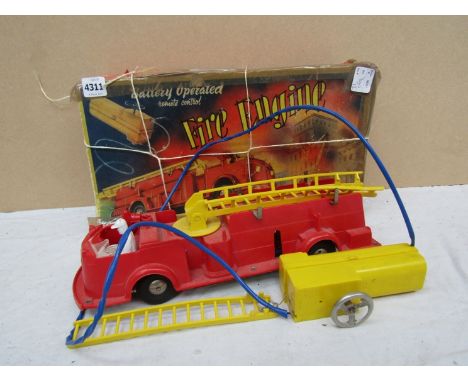 A Louis Marx &amp; Co fire engine and a quantity of plastic soldiers 