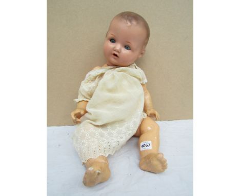 An Armand Marseille composition doll marked A M Germany 520/ 6K 