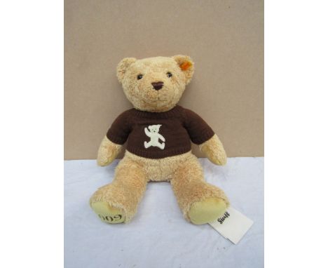 A Steiff goldbrown teddy bear with jumper 