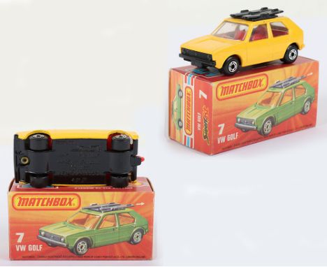 Matchbox Lesney Superfast Boxed Model, England: MB-7 VW Golf, Yellow body with GLOSS Black base &amp; CLEAR Glass, RED interi