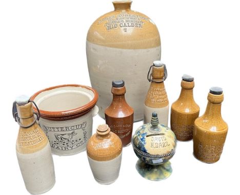 A Collection of stone ware pottery bottles; Scottish David H. Barr porcelain bank, Three Barr's Old Scotch Brewed Ginger beer