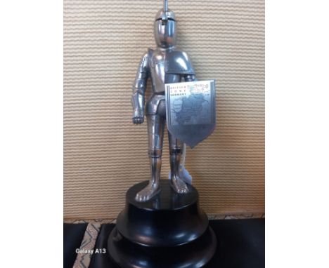 Vintage metal knight figural lighter, stood upon a musical base. [20cm high] 