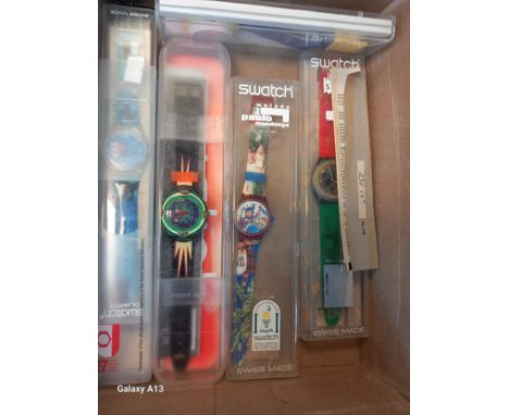 Fourteen various Swatch Watches- some loose and some with boxes. Together with various other watches and Swiss army knives. 