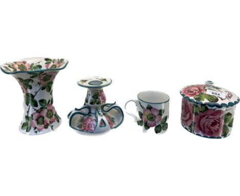 Four pieces of Wemyss Ware; Unusual designed candle holder- cabbage rose design. Biscuit barrel- damage to lid, Trumpet style