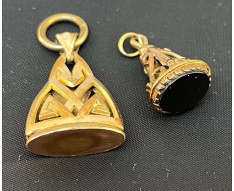 A 9ct gold seal, ornate support to the hardstone matrix, and a gilt metal seal, with Celtic style detail. [9ct-3.38grams] 