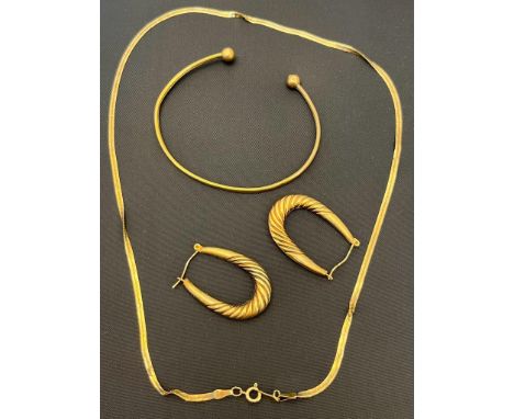Selection of 9ct gold jewellery; 9ct yellow gold bangle, 9ct hoop earrings and 9ct necklace. [5.74grams] 