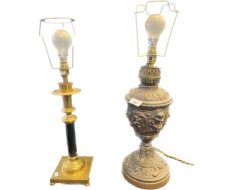 Two table lamps; Antique bronzed spelter highly decorative paraffin lamp base converted into a table lamp and brass table lam