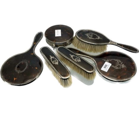 A lot of Five Birmingham silver and tortoise shell dressing table hand mirrors and brushes, together with a Birmingham silver