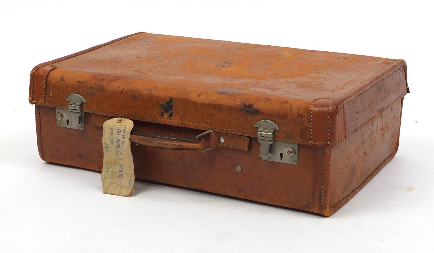 Vintage brown leather suitcase, retailed by Harrods, the lid impressed