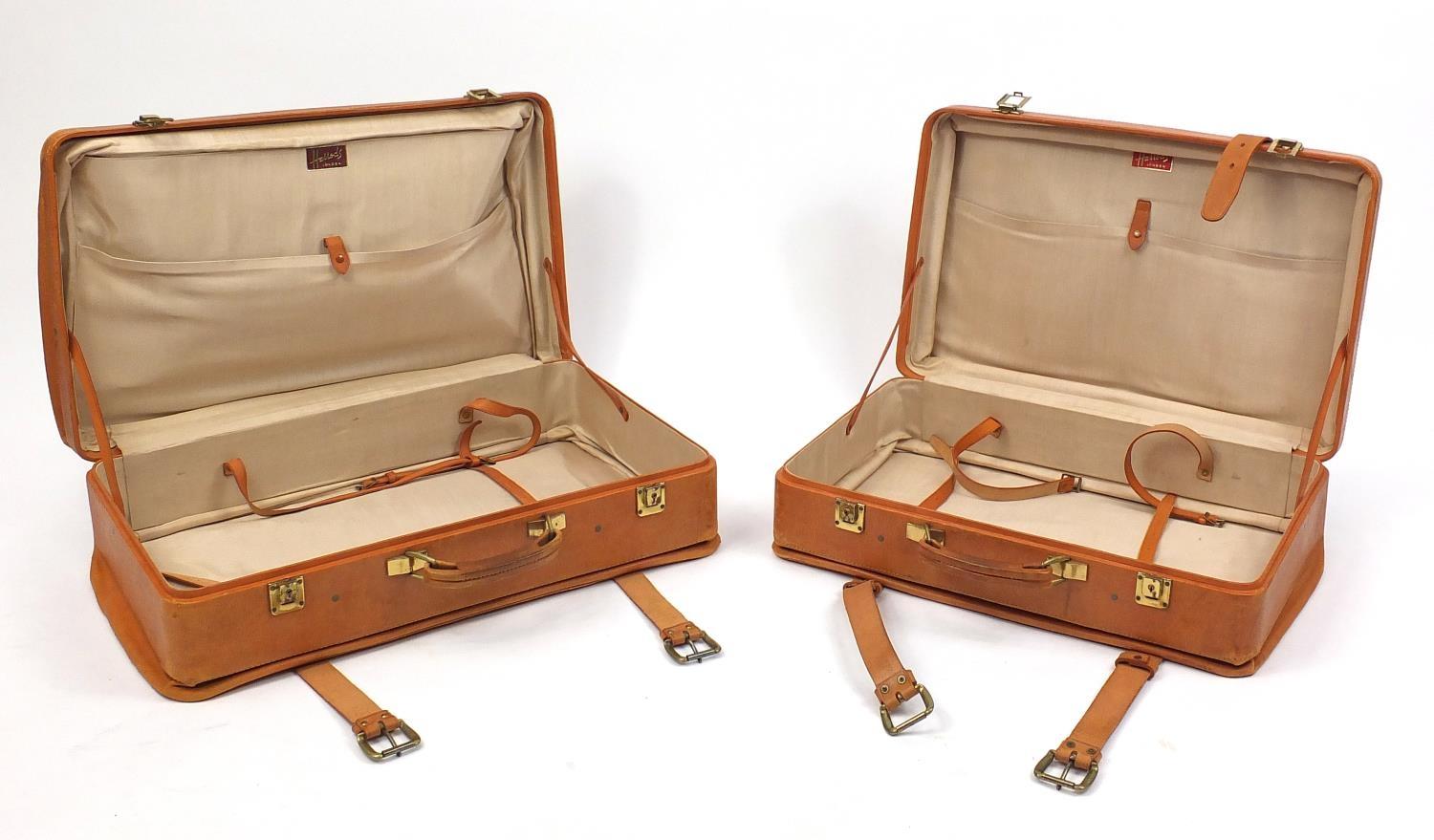 Two vintage leather suitcases, both retailed by Harrods, (PROVENANCE