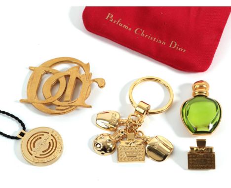 A Quantity of Christian Dior Costume Jewellery, comprising of a gilt metal Dior brooch; a Miss Dior lapel pin, in the form of