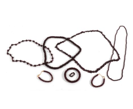 A Quantity of Garnet Jewellery, including four necklaces of varying designs, two bracelets, a bangle and a ring (8)