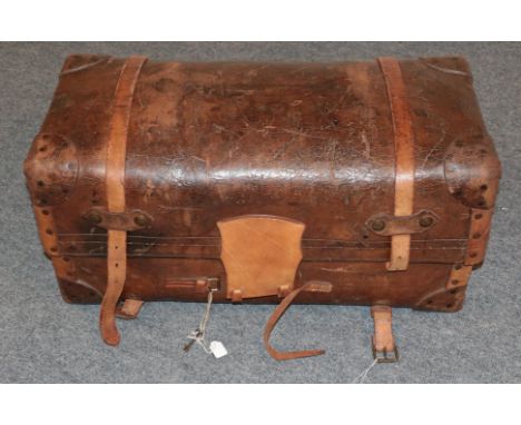 19th century brown leather trunk, hinged and enclosing a blue and white striped cotton lining to the interior, restored, 83cm