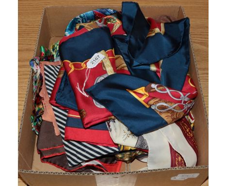 Assorted silk and polyester scarves including a Hermes silk scarf in red and blue silk decorated with crowns, a large English
