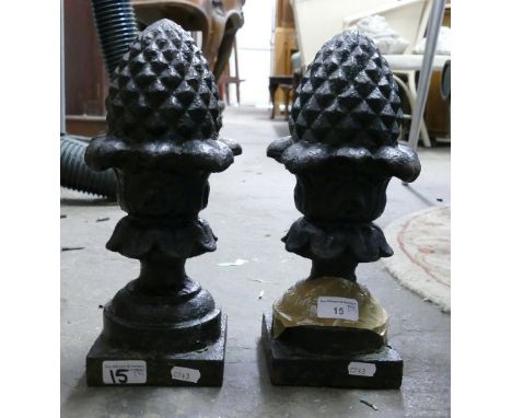 Two cast iron finial type pieces in the form of acorns