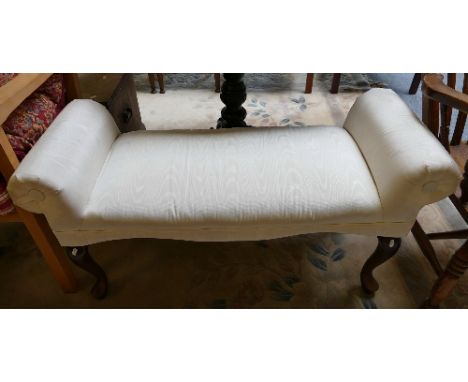 An upholstered bedroom bench seat