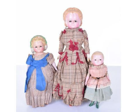 Three Pumpkin head wax over composition dolls, German circa 1860, all with black glass eyes, largest with moulded blonde hair