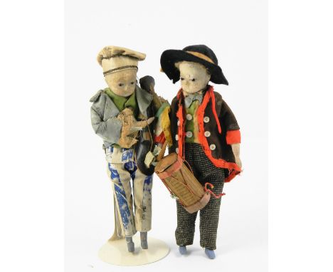 Pair of wax head Travelling Musician dolls, German circa 1860, both with black glass eyes, drummer holding stick wearing blac