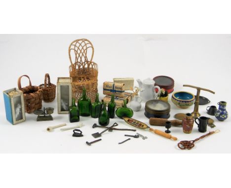 Collection of dolls house miniatures, including wicker chair and baskets, brass scales, set of green glass bottles, two tin-p