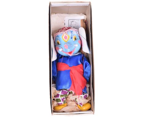 Pelham Puppet Elephant, 1963, carved painted head, hands and feet, felt ears, dressed, yellow box, excellent condition. 
