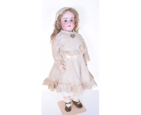 A Large Heinrich Handwerck/Simon & Halbig bisque head doll, circa 1910, with weighted blue glass eyes, re-set, painted lashes