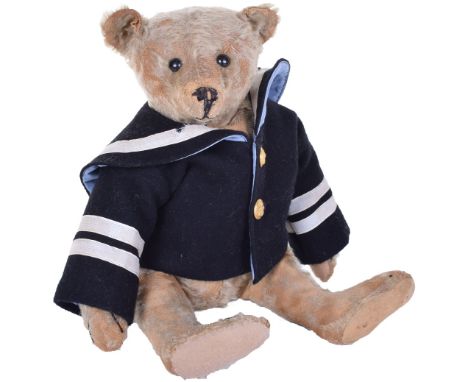 Steiff Teddy bear with centre seam, circa 1909, the brown straw filled mohair bear with black button eyes, stitched nose, mou