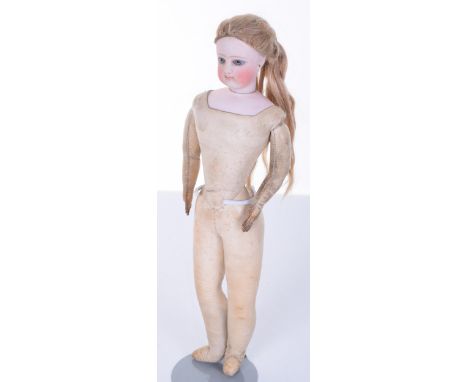 F.G bisque shoulder head fashion doll, circa 1870, with fixed light blue glass eyes, painted lashes and closed mouth, pierced