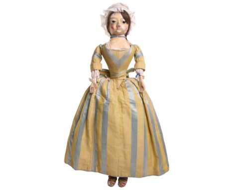 An important and large George II English wooden doll in original clothes, circa 1740, the gesso covered head with finely carv