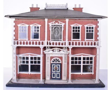 A Lines Brothers Grand Pillared Dolls house, English circa 1890, the red brick effect printed paper exterior, with painted wh