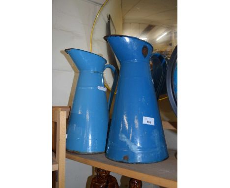 TWO BLUE ENAMEL JUGS