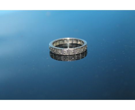 AN 18 CT WHITE GOLD AND DIAMOND ETERNITY RING