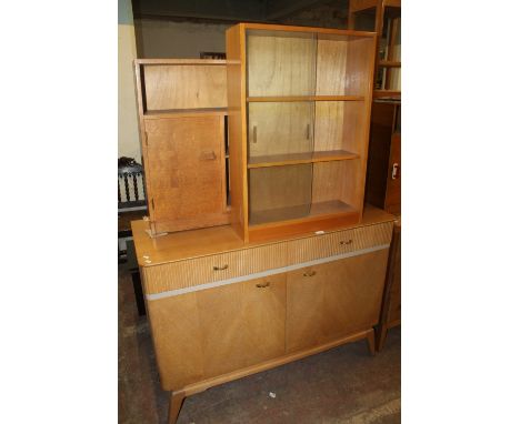 A LIGHT OAK SIDBOARD TOGETHER WITH TWO BOOKCASES