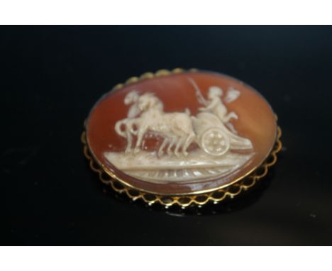 A 9CT GOLD CAMEO BROOCH++The brooch has marks and minor scratches from general wear and use, but is generally in solid and go