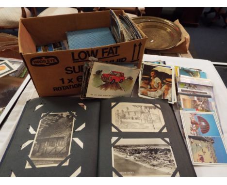 A mixed selection of assorted postcards to include scenic, architectural and an album housing earlier postcards mainly of sce