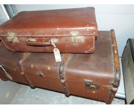 An early 20thC wooden bound steamer trunk together with a faux leather vintage suitcase etc
