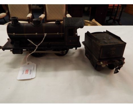 A Marklin 'O' gauge clockwork tank engine and tender the cab numbered 1080