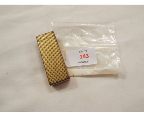 A Dunhill gold coloured lighter