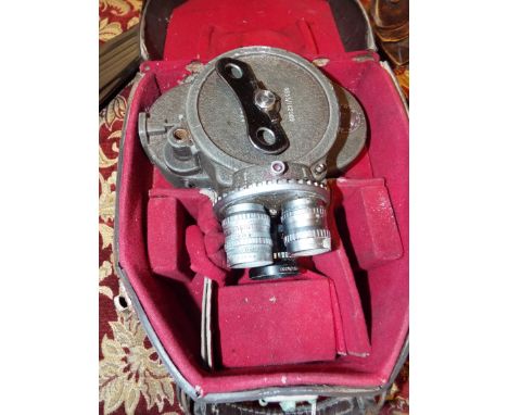 A Bell & Howell 70-DR cine camera with lenses and winder housed in original fitted case 