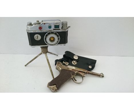 A KKW novelty camera cigarette lighter together with a Spanish novelty cigarette lighter modelled as a Revolver by Redando in
