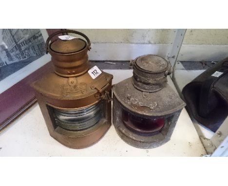 A modern reproduction metal cased ship's port light together with another.