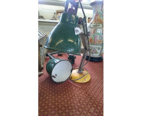 A green shaded enamelled industrial desk wall light together with another