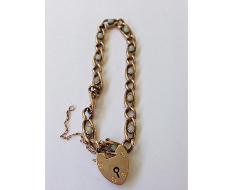A 9 carat gold and opal set bracelet and lock (7.7 grams overall).